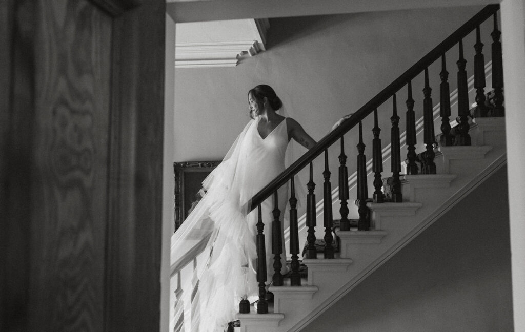 a different angle captured by the second photographer of the bride on steps