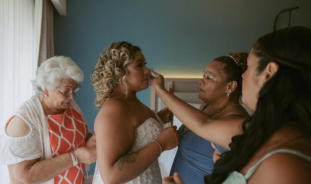 family in the moment as bride gets ready